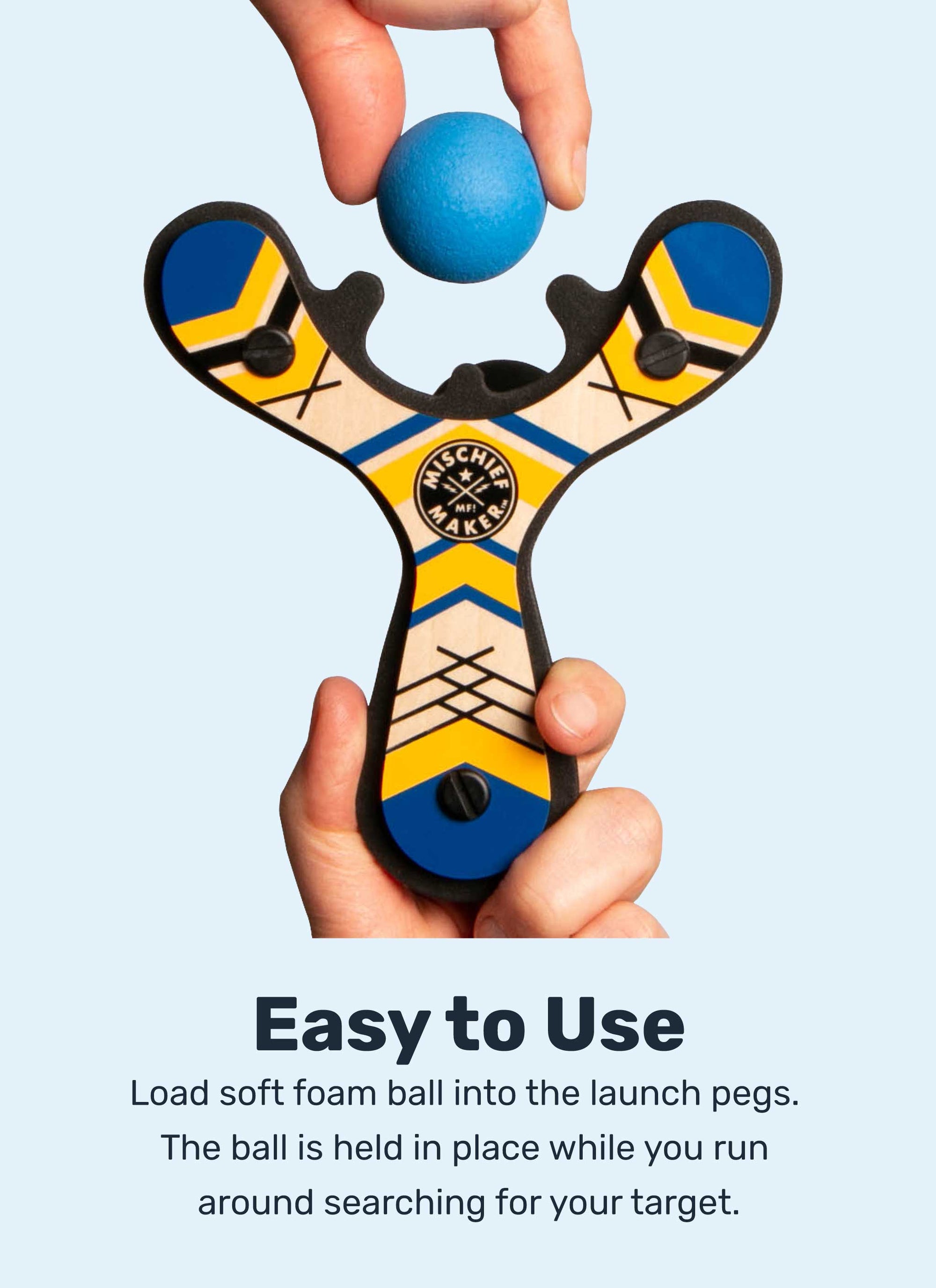 Blue Classic wood slingshot handheld with ball being loaded by Mighty Fun!