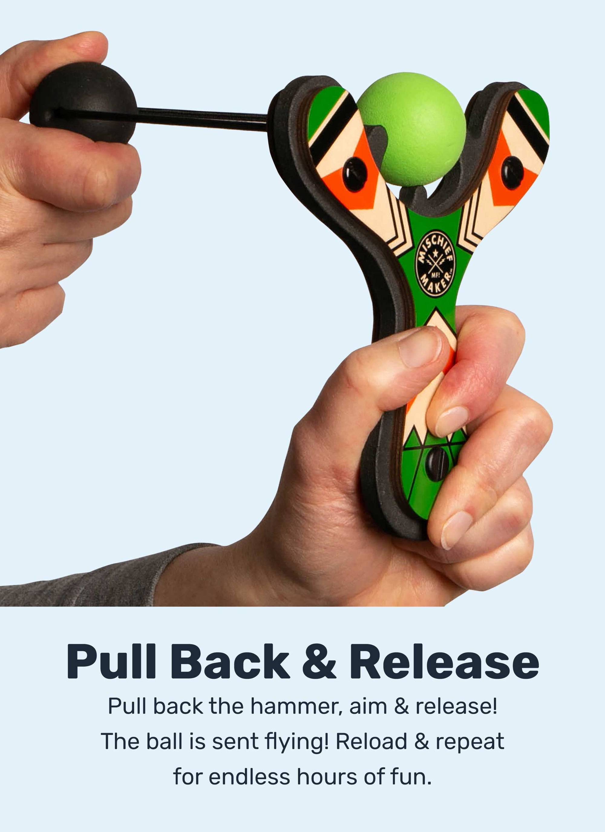 Green Classic wood slingshot being launched. Mischief Maker by Mighty Fun!