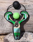 Green Surf’s Up toy slingshot with ball foam ball by the ocean. Mischief Maker by Mighty Fun!