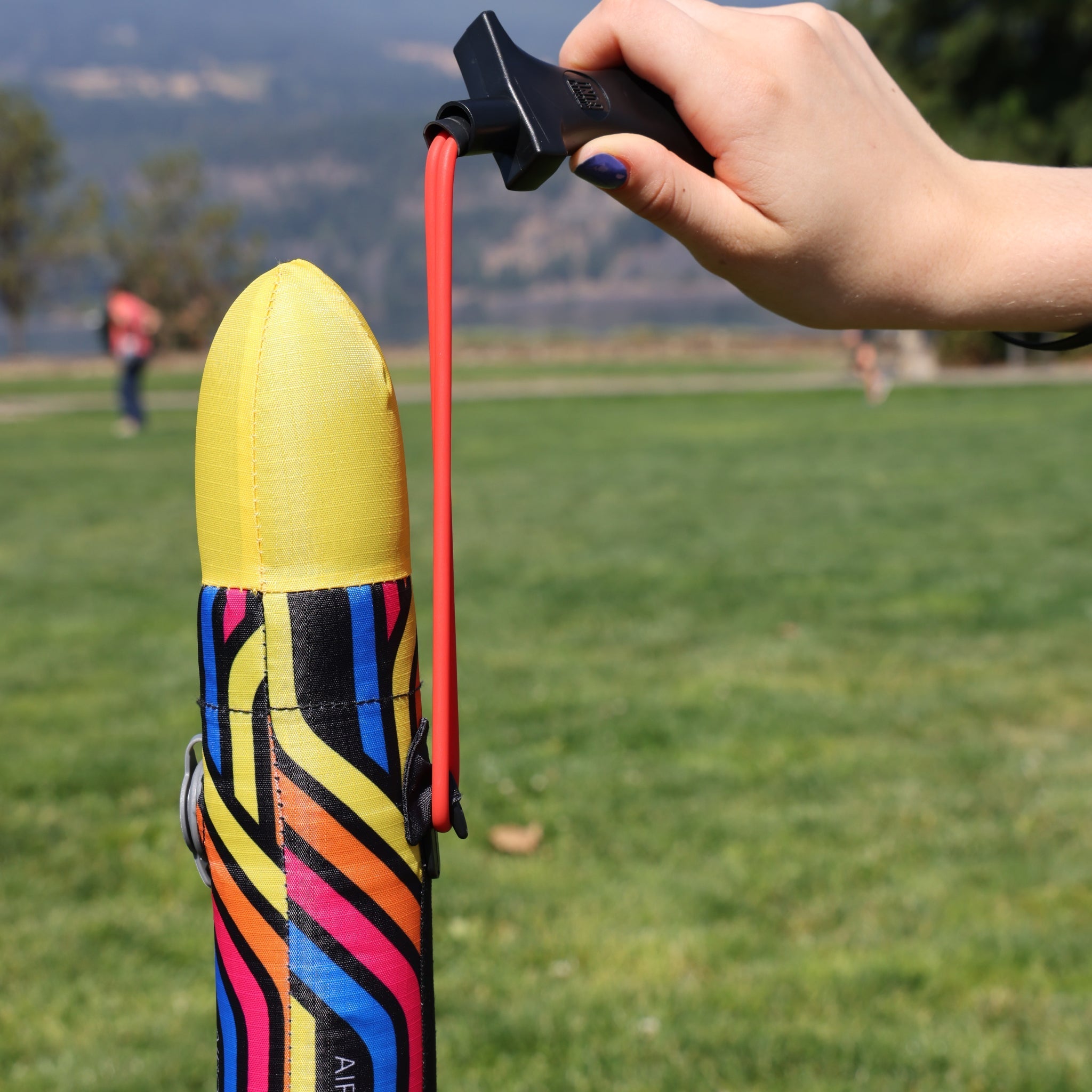 Yellow Airo Rocket toy rocket being launched outside. By Mighty Fun!