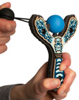 Blue Monster toy slingshot being launched. Mischief Maker by Mighty Fun!