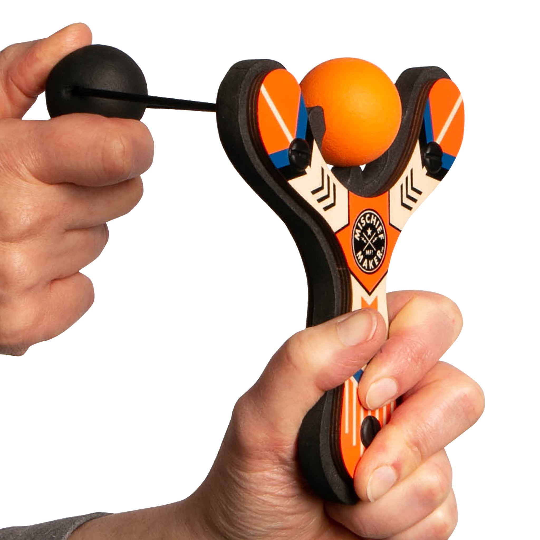 Orange Classic wood slingshot being launched. Mischief Maker by Mighty Fun!