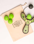 Green Monster toy slingshot with 4 soft foam balls and storage bag. Mischief Maker by Mighty Fun!