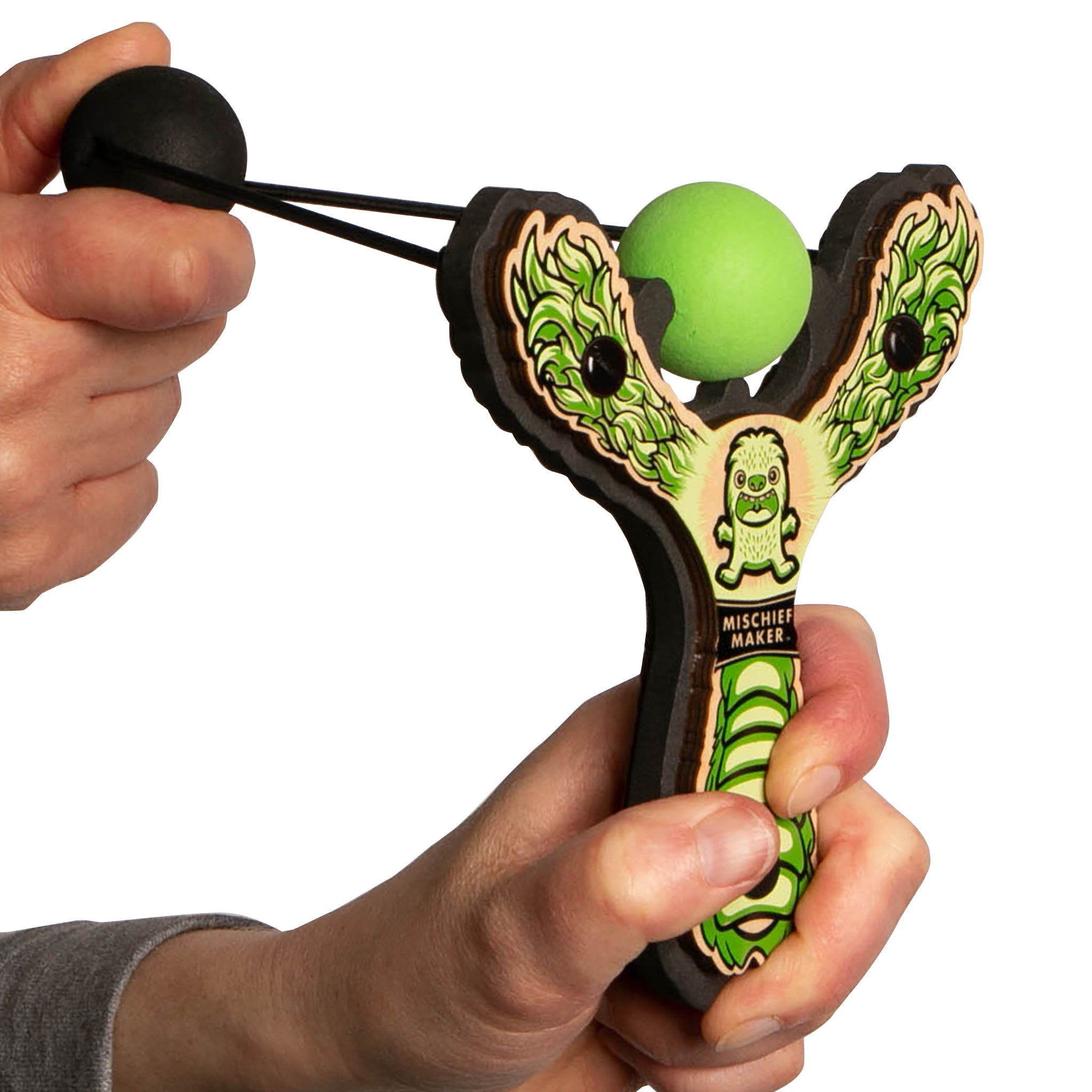 Green Monster toy slingshot being launched. Mischief Maker by Mighty Fun!