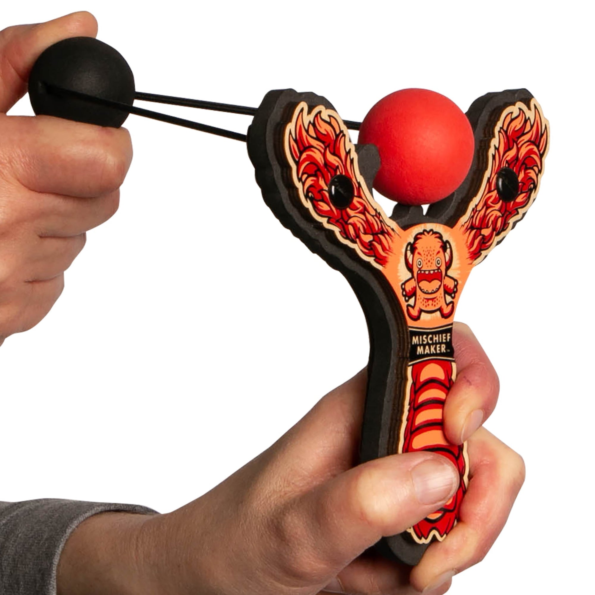 Red Monster toy slingshot being launched. Mischief Maker by Mighty Fun!