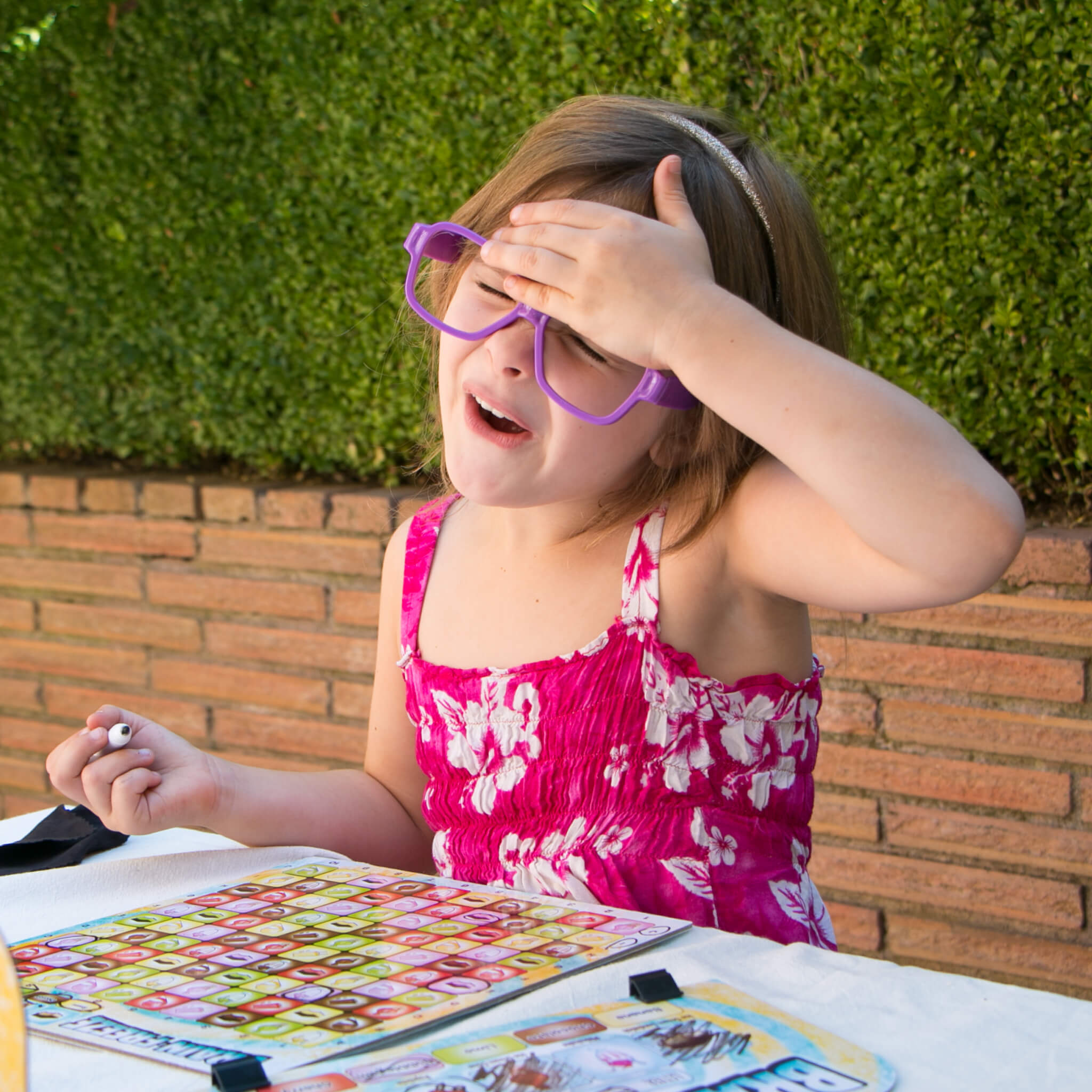 Kids Playing Brain Freeze Strategy board game by Mighty Fun! Ages 5 up.