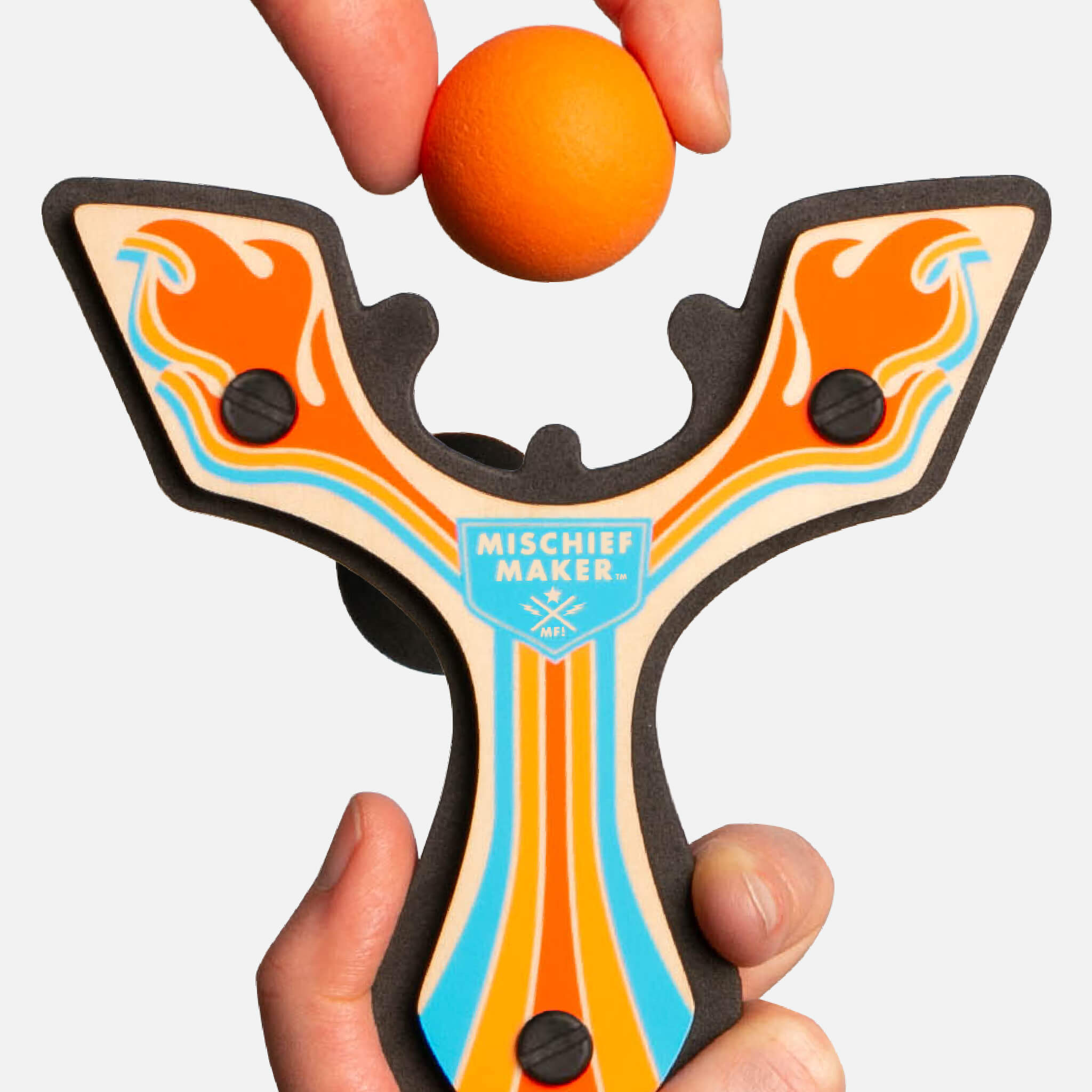 Orange Racing best slingshot being loaded with a soft foam ball. Mischief Maker by Mighty Fun!