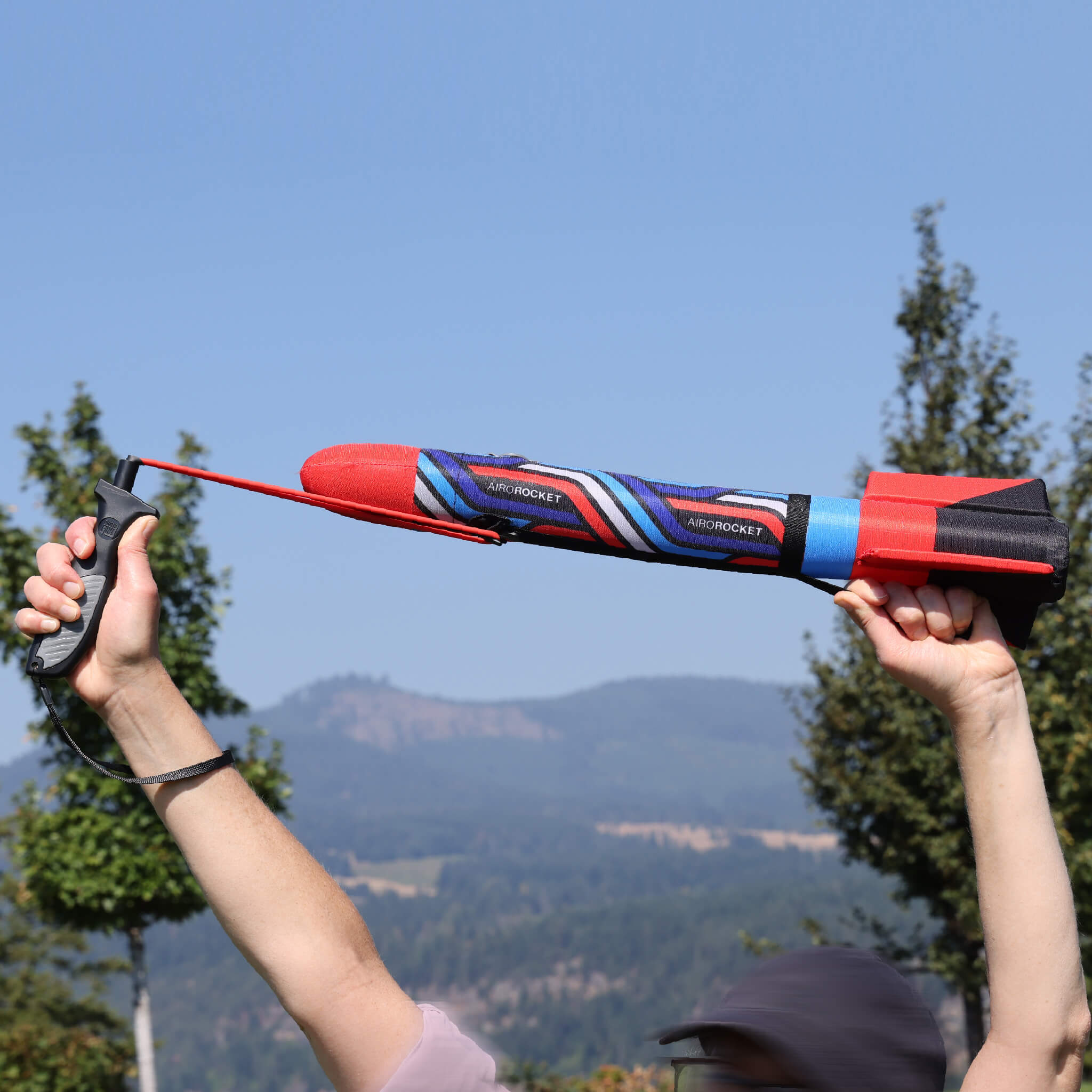 Red Airo Rocket toy rocket being launched outside. By Mighty Fun! 