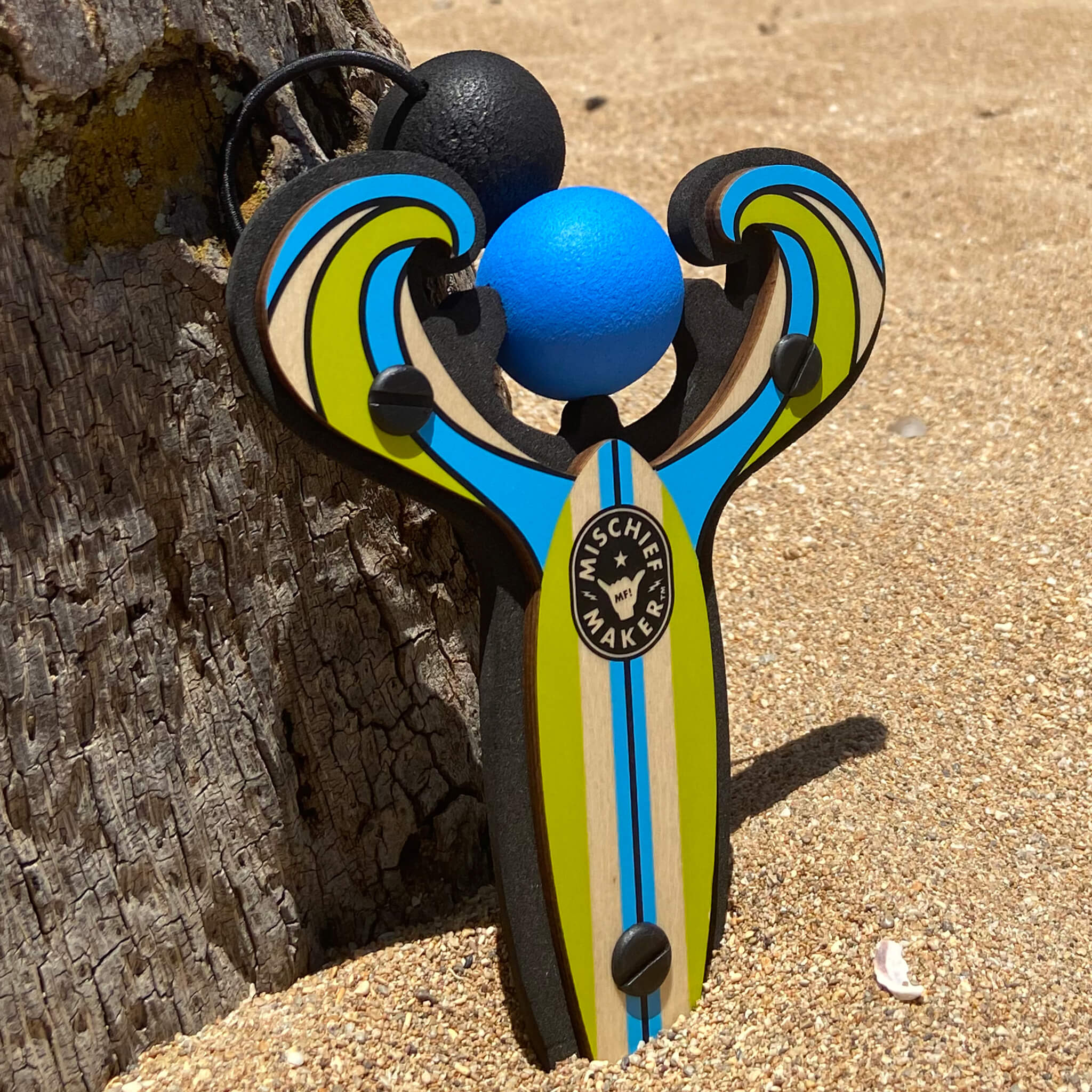 Blue Surf’s Up toy slingshot by the beach. Mischief Maker by Mighty Fun!