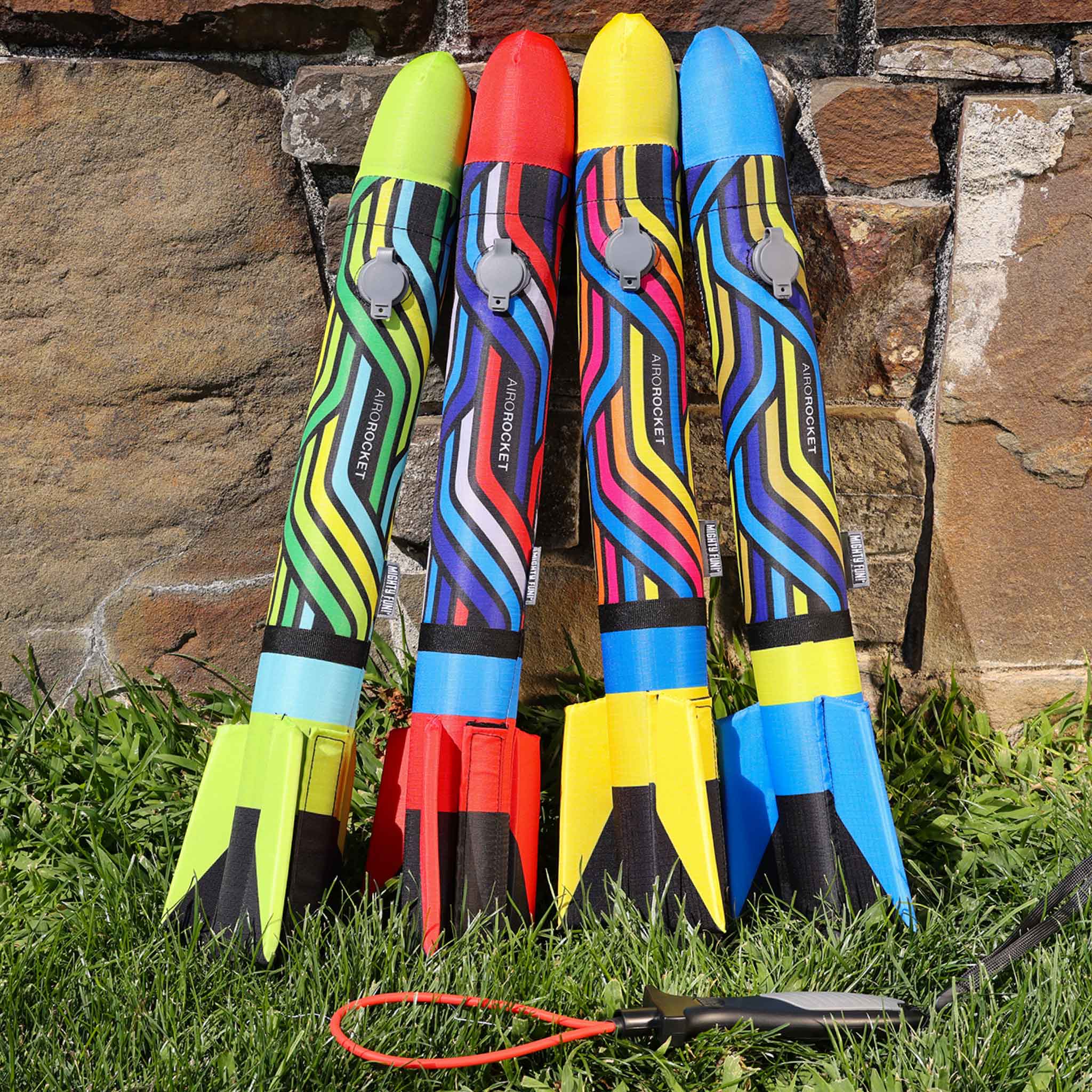 Airo Rocket toy rocket in all 4 colors: red, lime, yellow and blue outside by Mighty Fun!