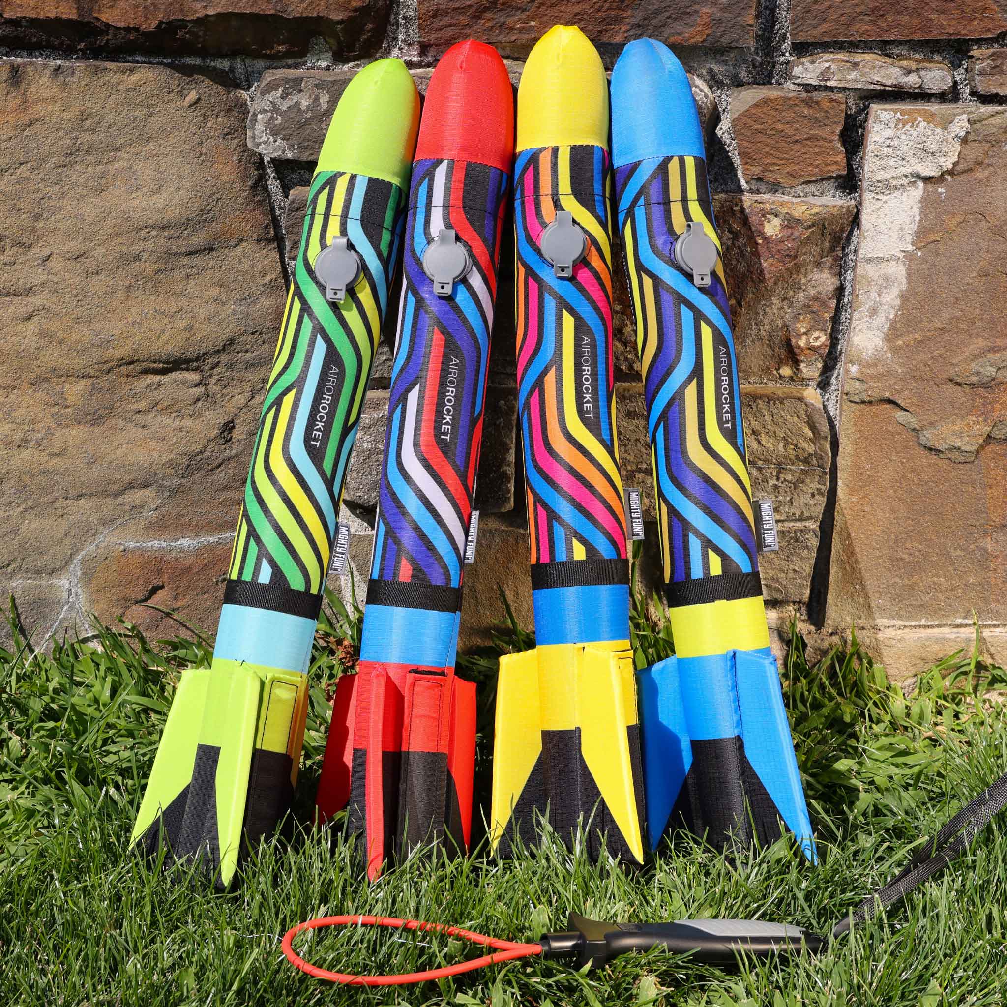Airo Rocket toy rocket in all 4 colors: red, lime, yellow and blue outside by Mighty Fun!