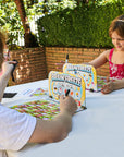 Kids Playing Brain Freeze Strategy board game by Mighty Fun! Ages 5 up.