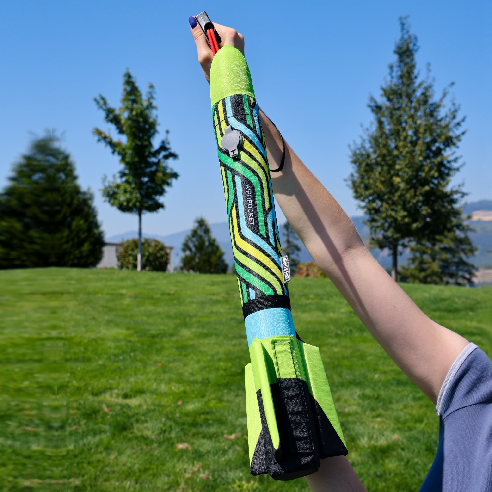 Lime Airo Rocket toy rocket being launched outside. By Mighty Fun!