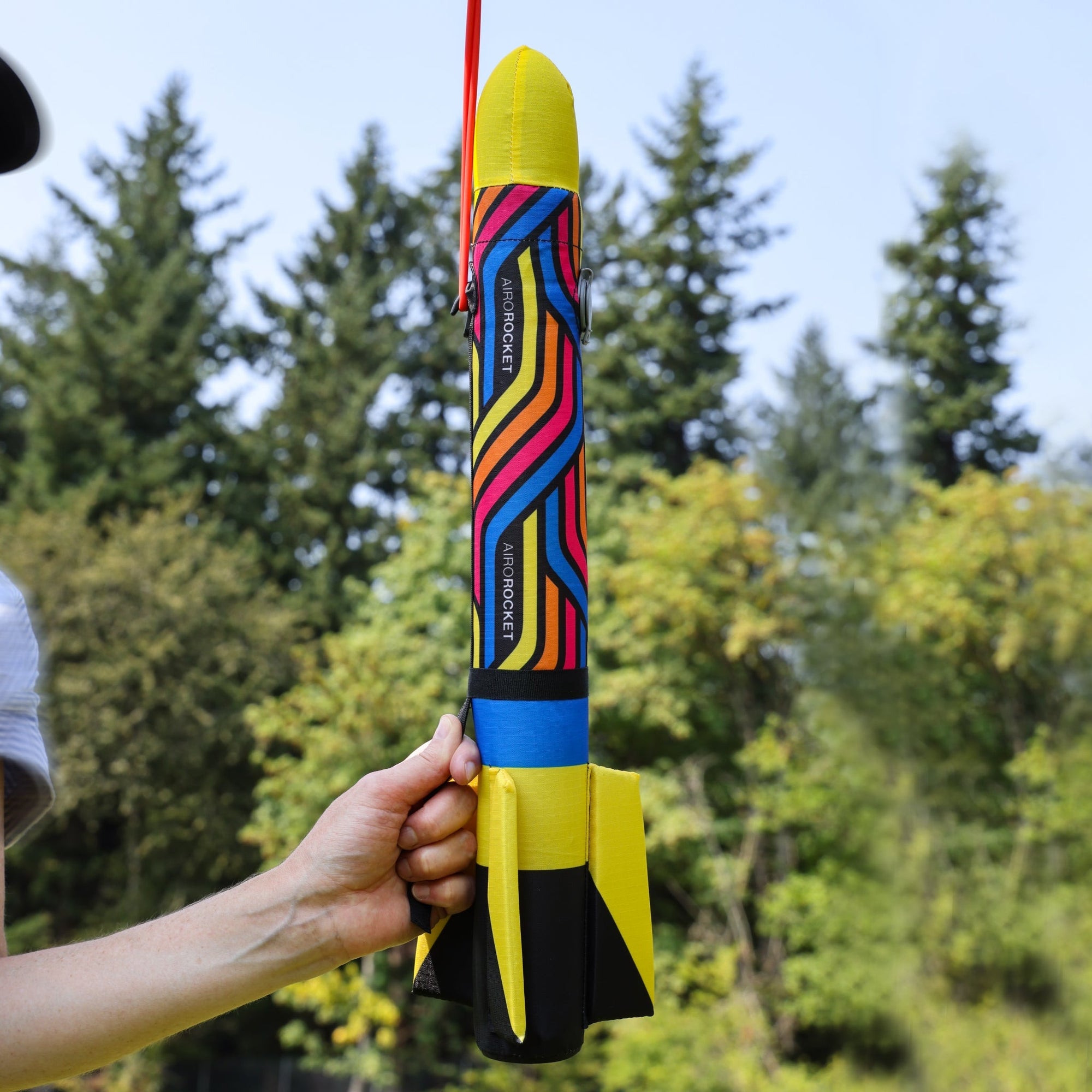Yellow Airo Rocket toy rocket being launched outside. By Mighty Fun!