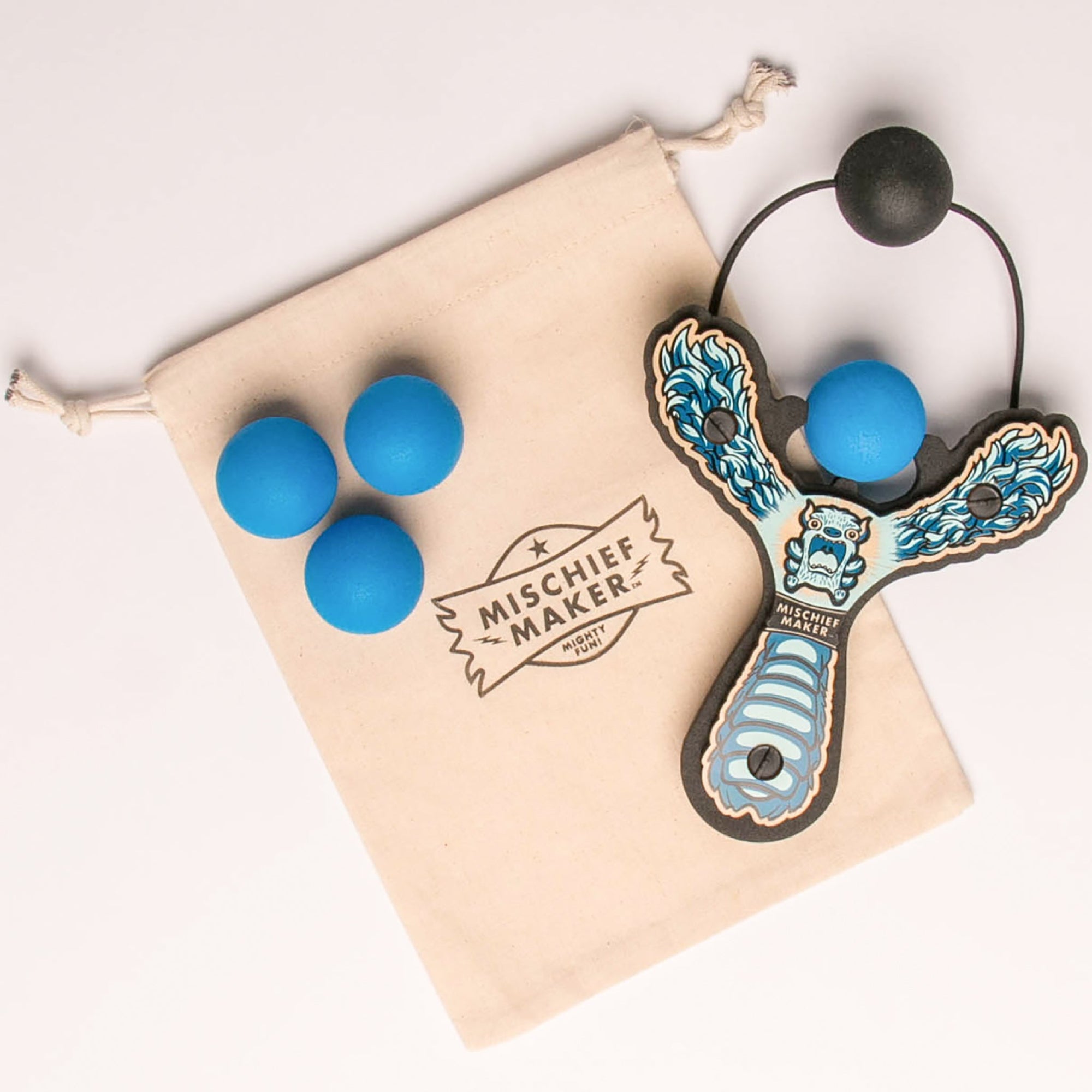 Blue Monster toy slingshot with 4 soft foam balls and storage bag. Mischief Maker by Mighty Fun!