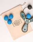 Blue Monster toy slingshot with 4 soft foam balls and storage bag. Mischief Maker by Mighty Fun!