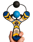 Blue classic wooden Mischief Maker kids toy slingshot loaded in hand. By Mighty Fun!