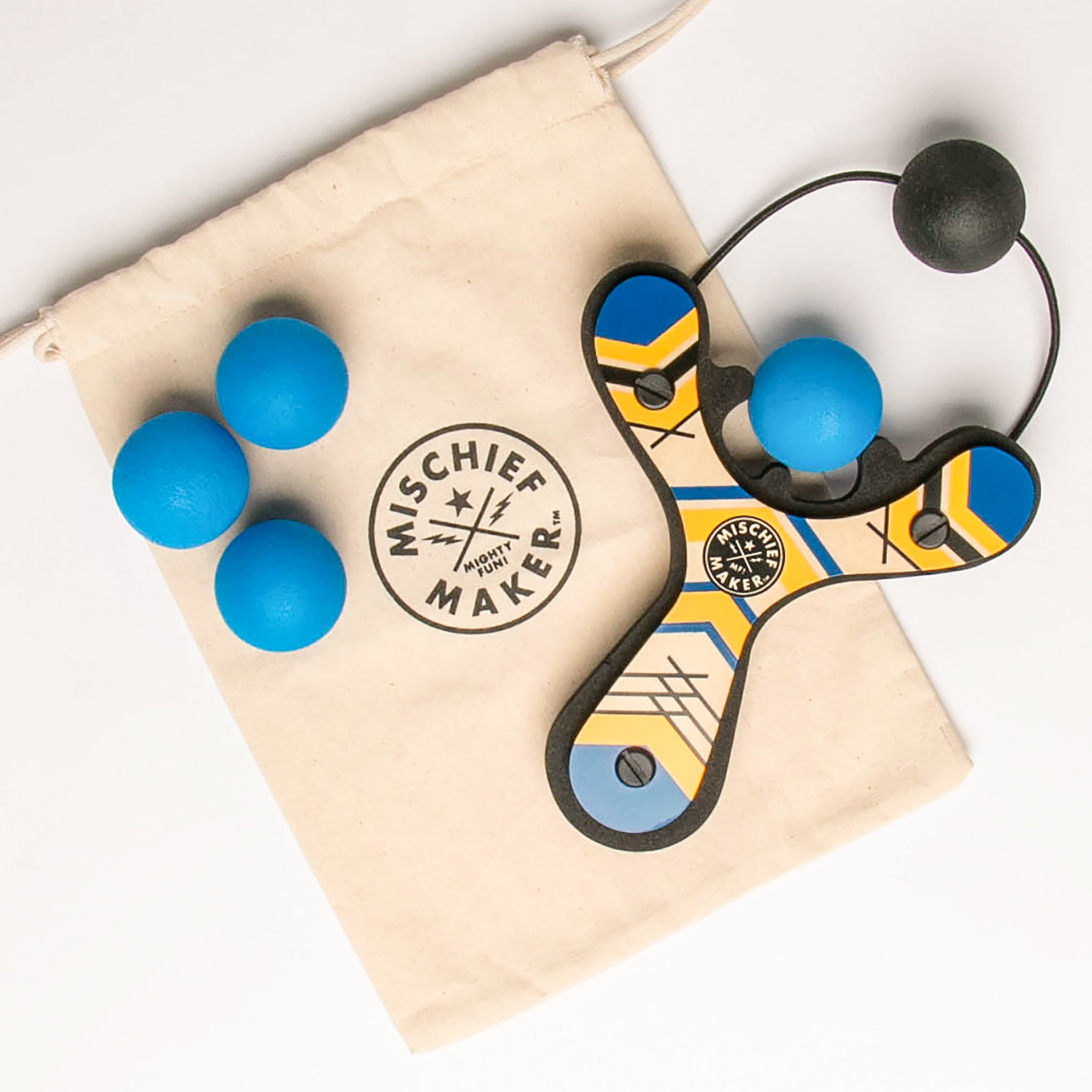 Blue classic wooden Mischief Maker kids toy slingshot with 4 soft foam balls and storage bag. By Mighty Fun!