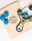 Blue classic wooden Mischief Maker kids toy slingshot with 4 soft foam balls and storage bag. By Mighty Fun!