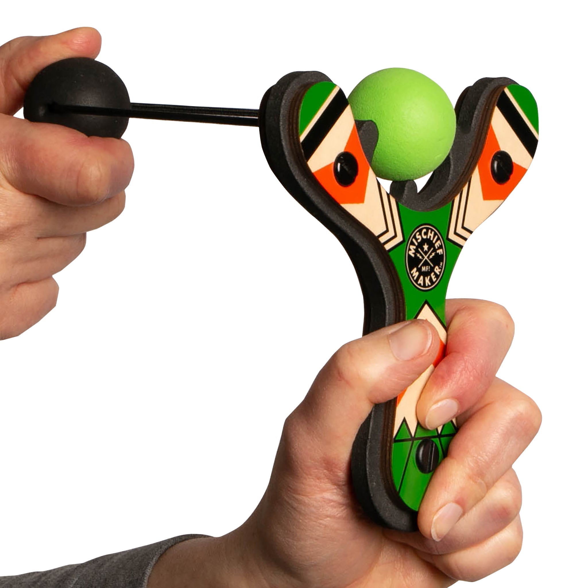 Green Classic wood slingshot being launched. Mischief Maker by Mighty Fun!
