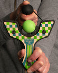 Green Racing best slingshot being shot by 6 year old boy. Mischief Maker by Mighty Fun!
