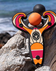 Orange Surf’s Up toy slingshot by the beach. Mischief Maker by Mighty Fun!