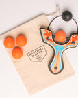 Orange Racing best slingshot with 4 soft foam balls and storage bag. Mischief Maker by Mighty Fun!