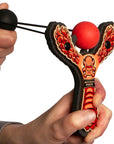 Red Monster toy slingshot being launched. Mischief Maker by Mighty Fun!