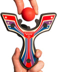 Red Racing best slingshot being loaded with a soft foam ball. Mischief Maker by Mighty Fun!